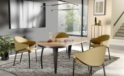 Stół industrialny okrągły rozkładany 100-138 LUNGO dąb craft złoty, czarne metalowe nogi, w eleganckiej aranżacji wnętrza z żółtymi krzesłami i nowoczesnymi dodatkami.jpg