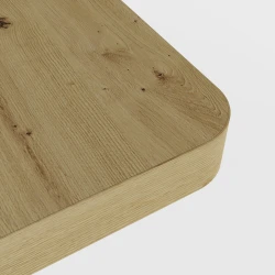 Zbliżenie na grubość blatu biurka BIMOTION w kolorze dąb artisan, z zaokrąglonymi krawędziami.