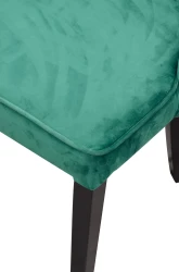 Pikowane krzesło z kołatką do salonu w stylu glamour K92 zielone - nogi czarne - zbliżenie na róg siedziska
